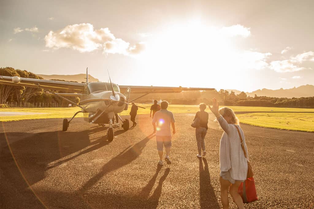Passengers boarding Barrier Air flight from Great Barrier Island