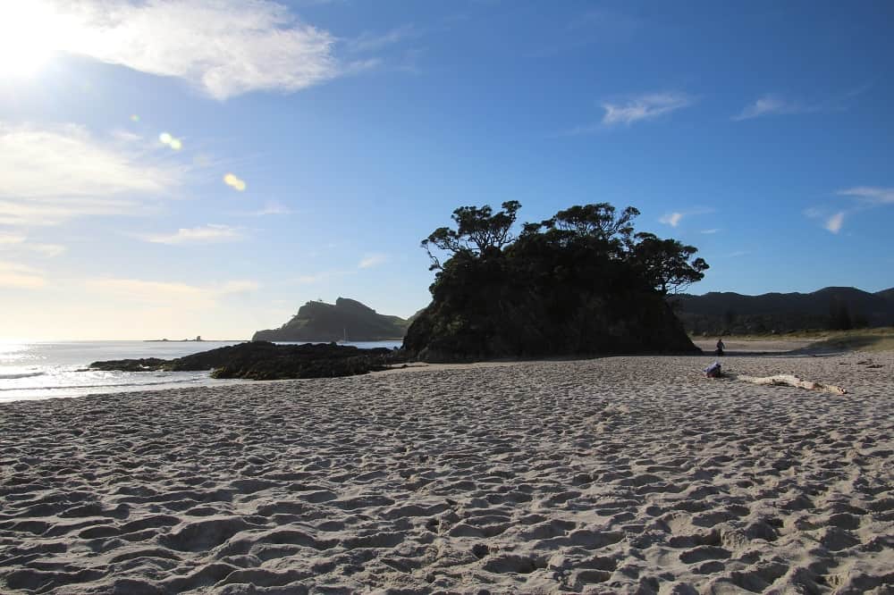 A view of Memory Rock on sandy Medlands beach Great Barrier Island