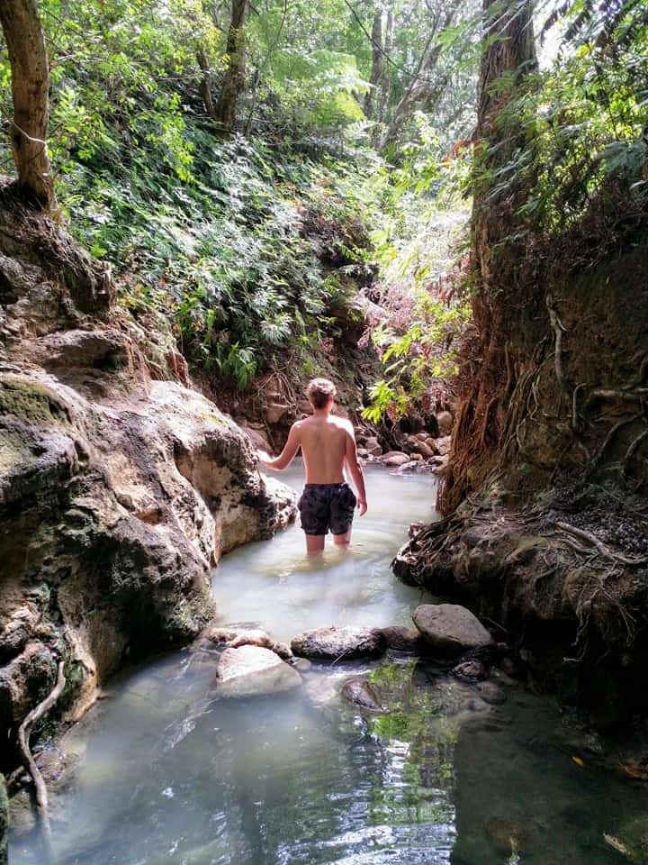 Man in the Kaitoke hot springs on Great Barrier Island