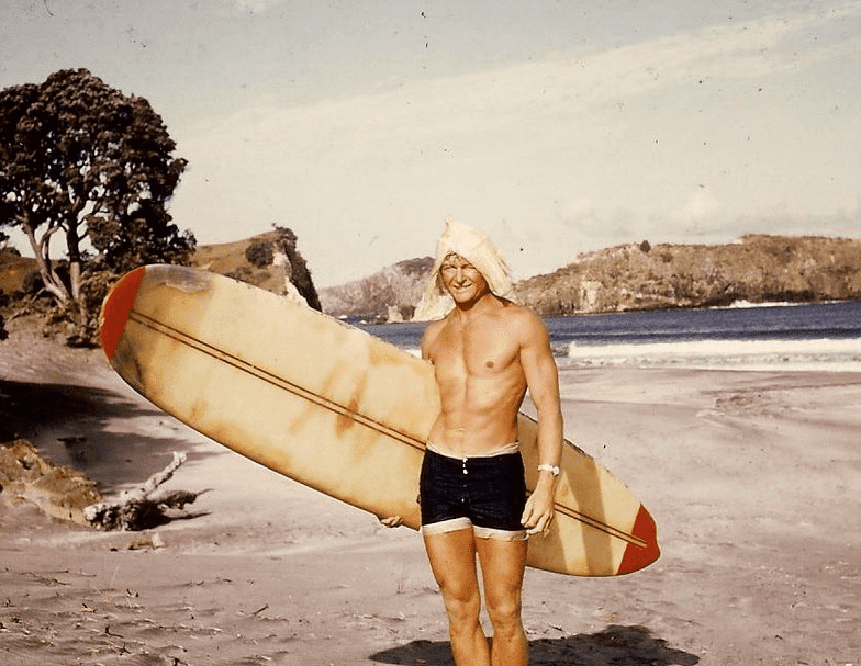 Surfer Medlands beach Great Barrier Island